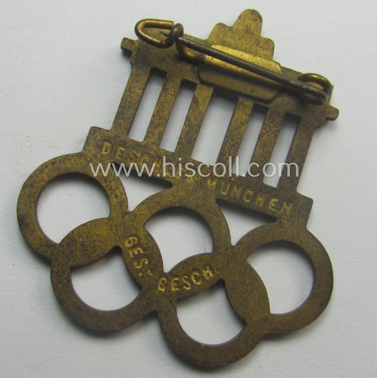 Commemorative - and neatly enamelled! - 'Veranstaltungsabzeichen' being a maker- (ie. 'Deschler'-) marked example that is showing the Olympic-rings above an illustration of the: 'Reichstag' coupled with the text: 'XI. Olympiade Berlin 1936'