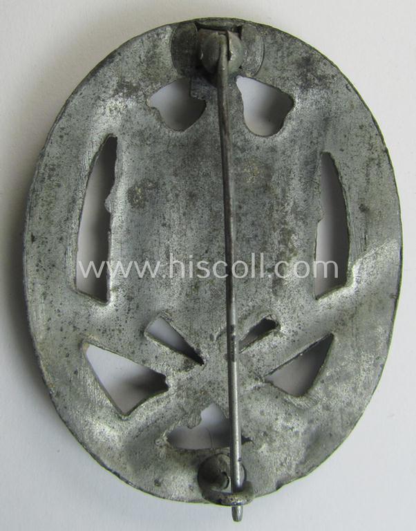 'Allgemeines Sturmabzeichen' (or: General Assault Badge ie. GAB) being a typical unmarked, zinc-based- (ie. 'Feinzink'-) and/or: 'semi-hollow-back'-version as was (I deem) produced by the: 'Rudolf Karneth'-company