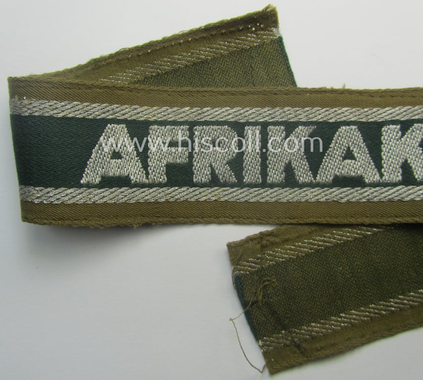 'BeVo'-like cuff-title (ie. 'Ärmelstreifen') entitled: 'Afrikakorps' being a clearly issued example that comes in an overall nice- (ie. hardly shortened- and just moderately worn-), condition