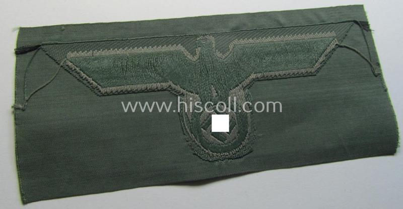 WH (Heeres) related breast-eagle (ie. 'Brustadler für Mannschaften u. Uffz. des Heeres') being a 'standard-issue'-pattern-example as executed in the 'BeVo'-weave-pattern on a field-grey-coloured background