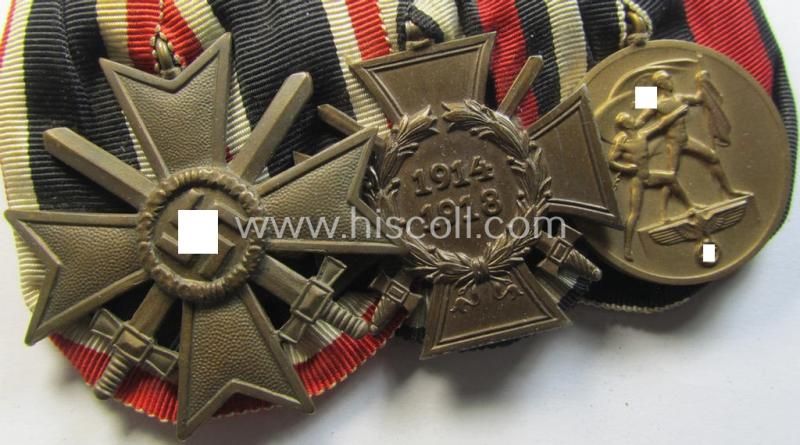 Three-pieced medal-bar (ie. 'Ordenspange') respectively depicting a: 'KvK II. Klasse m. Schw.', a: WWI-period: 'Frontkämpferkreuz 1914-18' (ie.: 'Kriegsteilnehmerkreuz mit Schwertern') and a: Czech  'Anschluss'-medal: '1 Oktober 1938'