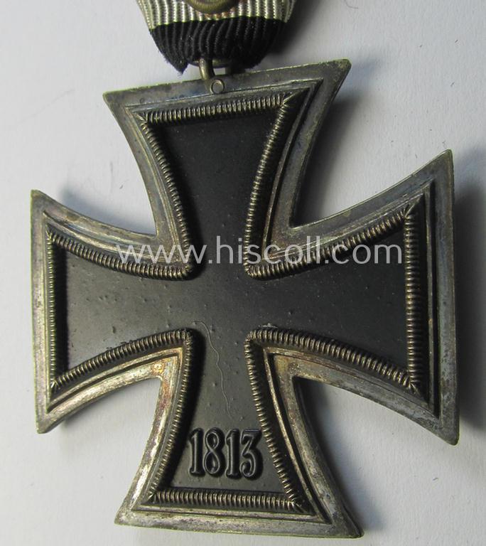 Neat, Iron Cross 2nd class (or: 'EK II. Klasse') being a non-maker-marked example that comes mounted onto its original (Austrian-styled!) ribbon (ie. 'Bandabschnitt') as was (I deem) produced by the (Austrian-based) company named: 'Rudolf Souval...