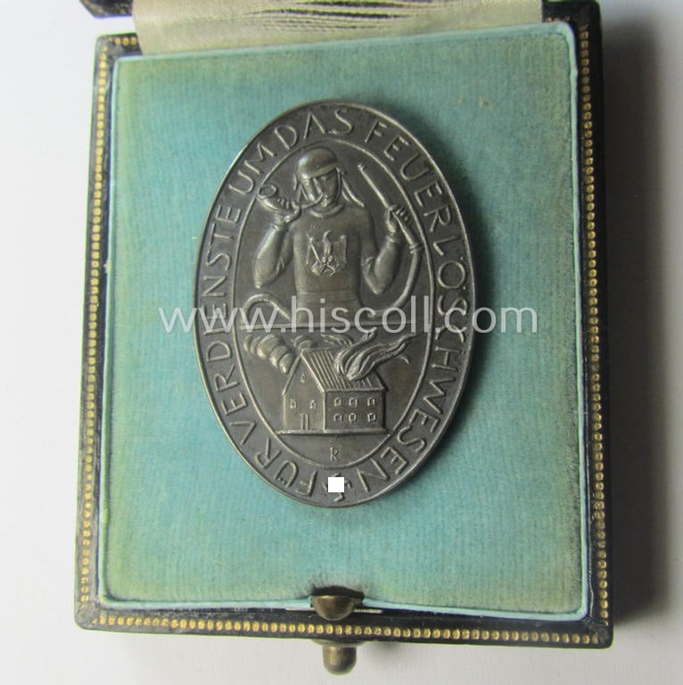 Pre-war-period- and/or genuine silver-based, so-called: 'Erinnerungszeichen Verdienste um das Feuerlöschwesen 1934' being a detailed- and maker- (ie. 'Preuss. Staatsmünze'-) marked, example that comes in its etui