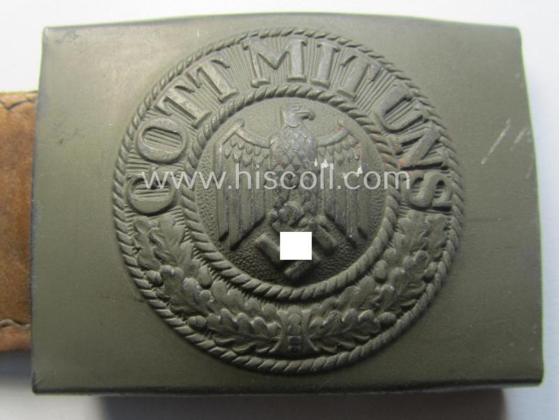 'Virtually mint', 'standard-issue'-pattern, WH (Heeres) field-grey-toned- and steel-based belt-buckle being a non-maker-marked example that comes mounted onto its 'G.H. Osang'-marked and/or '1940'-dated tab