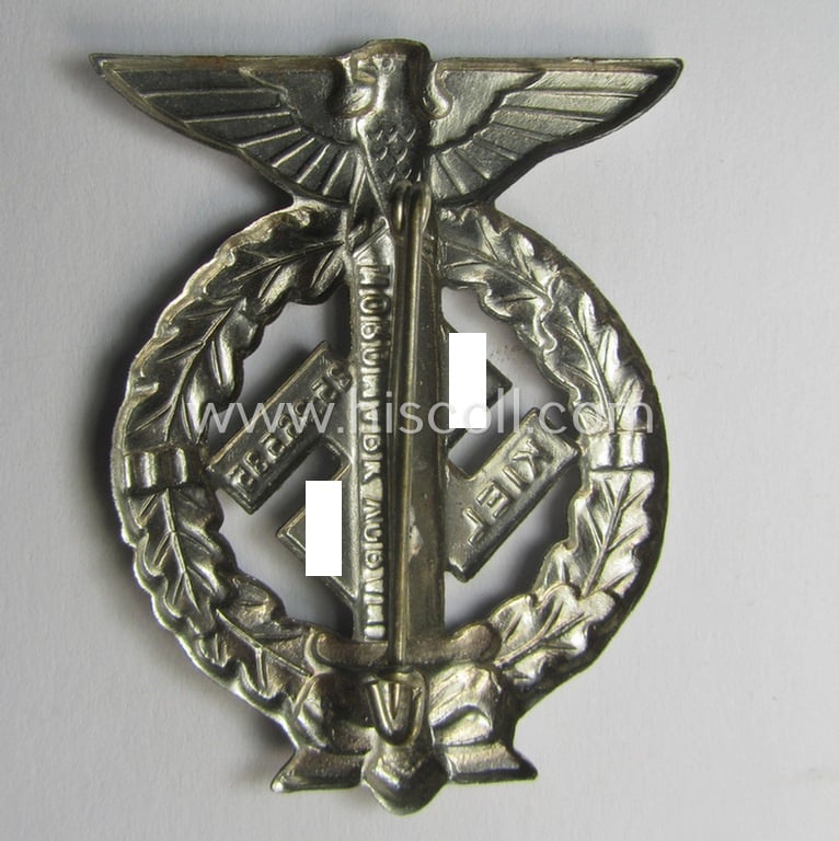 Commemorative, bright-silver-coloured- and/or tin-based, N.S.D.A.P.- (ie. SA-) related 'tinnie' being a non-maker-marked example depicting an upward-positioned sword, swastika and text that reads: 'Nordmark Voran - Kiel - 25.26.5.1935'