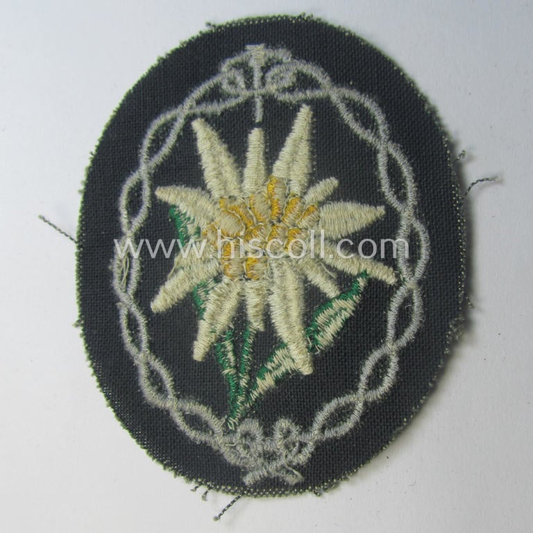 'Variant'-pattern WH (Heeres) 'Gebirgsjäger'- (ie. mountain-troopers-) related arm-badge, being a desirable example as was executed in the machine-woven pattern on a thin-shaped and darker-green-toned background