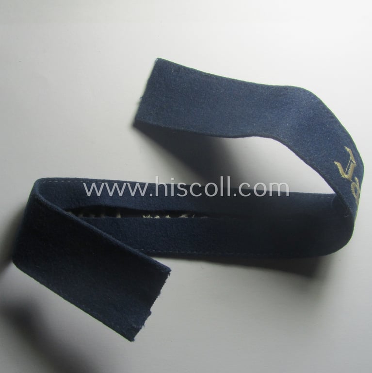 Moderately used, WH (Luftwaffe) cuff-title ie. armband (ie. 'Ärmelstreifen') entitled: 'Jagdgeschwader Udet' that comes in a clearly worn- ie. carefully tunic-removed-, condition