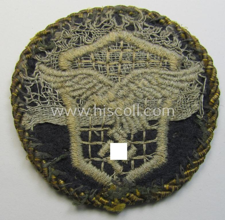 Attractive - albeit clearly used! - example of a WH (Luftwaffe) machine-embroidered, trade- ie. special-career-patch (ie. 'Tätigkeitsabzeichen') having a golden-coloured 'Goldkordel' attached as was intended for: 'LW-Kraftfahrpersonal'