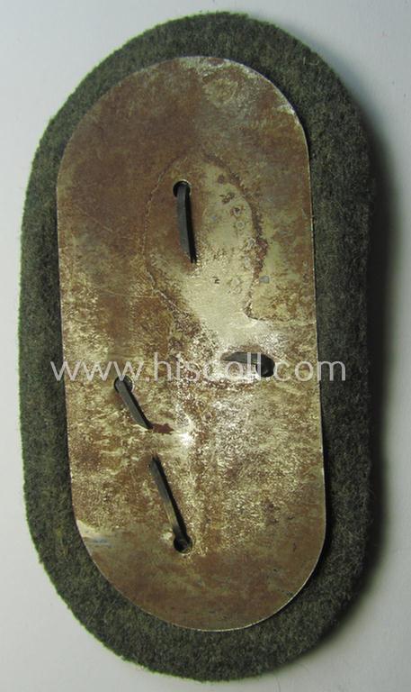 WH (Heeres ie. Waffen-SS) 'Demjansk'-campaign-shield as executed in typical magnetic metal (ie. so-called: 'Eisenblech') and that comes in an overall very nice- ie. fully untouched, condition