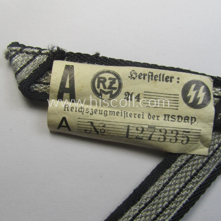SS (ie. 'Allgemeine o. Waffen-SS') arm-insignia being an 'SS', so-called: 'Ehrenwinkel für Altgediente Kämpfer o. Angehörigen der SS' (or: honorary-chevron for old campaigners) still retaining its period 'RzM'-etiket