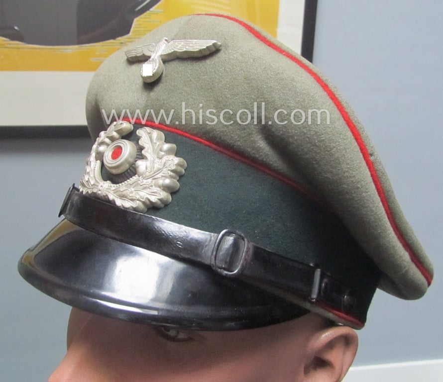 Superb example of a WH (Heeres) bright-red-piped, EM- (ie. NCO-) type visor-cap 'Schirmmütze für Mannschaften u. Unteroffiziere der (Sturm)Artillerie-Truppen' and that comes in a truly wonderful- and totally untouched, condition