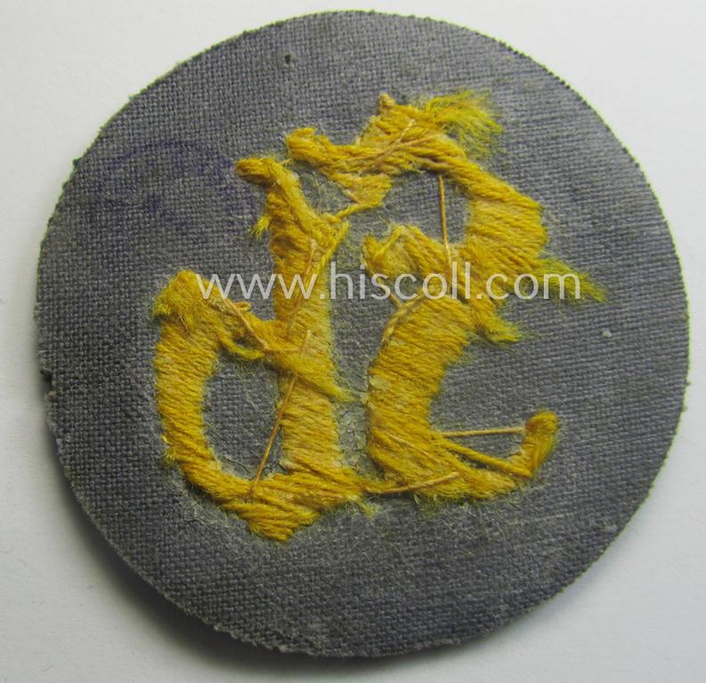 WH (Heeres) so-called: trade- and/or special-career arm-insignia as was intended for a: 'Festungsbau-Feldwebel' (being a neatly hand-embroidered 'variant' as mounted on darker-green-coloured wool)