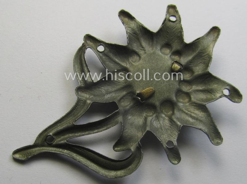 WH (Heeres) (bright) silverish-coloured, zinc-based (albeit non-maker-marked): 'M43'-pattern 'Edelweiss'-cap-badge (ie. 'Mützenabzeichen')