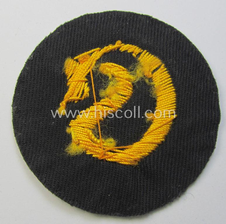 WH (Heeres) so-called: trade- and/or special-career arm-insignia (ie. 'Laufbahn- o. Tätigkeitsabzeichen') as intended for a: 'Schirrmeister' (being a neatly hand-embroidered variant as mounted onto a darker-green woolen background)