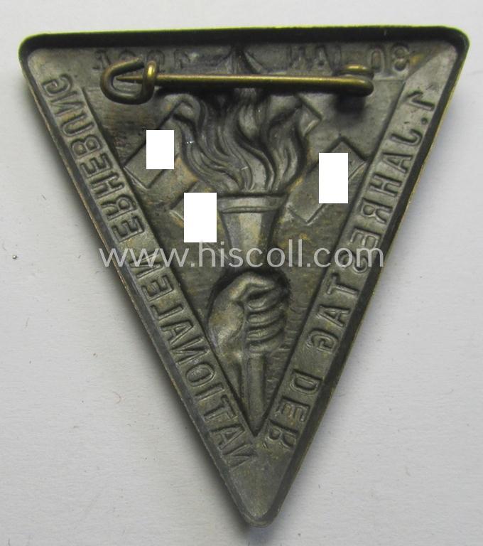 Commemorative, golden-bronze-coloured N.S.D.A.P.-related 'tinnie' being a non-maker-marked example depicting a hand holding a torch surrounded by the text: '1. Jahrestag der Nationalen Erhebung - 30. Jan. 1934'