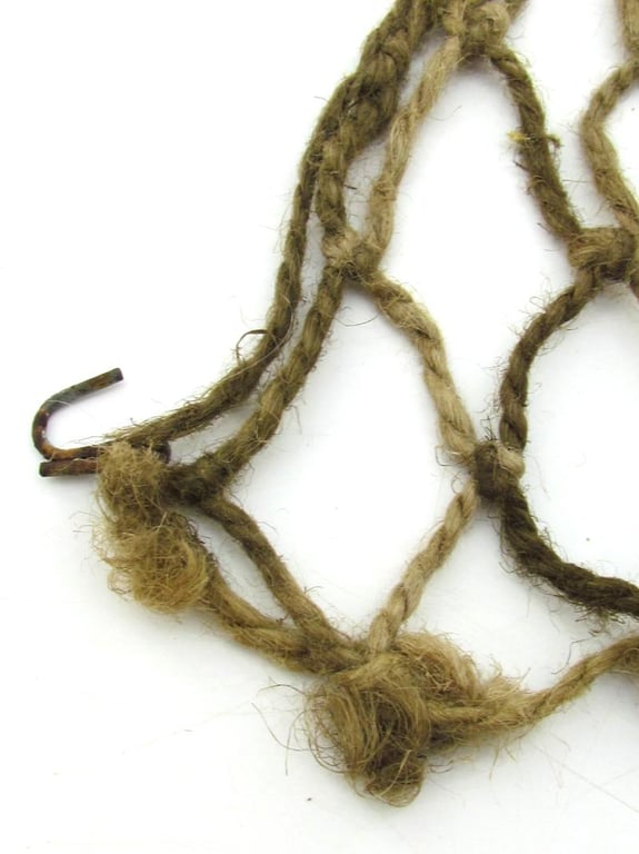 Complete late war German helmet net with attachment hooks