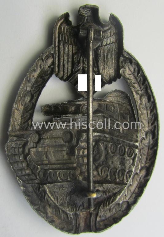 'Panzerkampfabzeichen in Silber' (or: silver-class panzer-assault badge or PAB) being a (typical) non-maker-marked- and/or hollow zinc- (ie. 'Feinzink'-) based example as was produced by the: 'Wilh. Deumer'-company