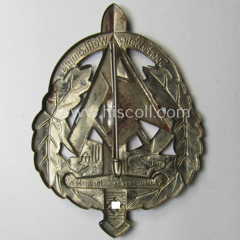 Commemorative, SA- (ie. 'Sturmabteilungen'-) related 'tinnie' depicting an illustration of an 'SA-Sportabzeichen' and typical SA-logo coupled with the text: 'Sport- u. Wehrwettkämpe - SA-Gruppe 24./25.Juli - Niederrhein - 1939'