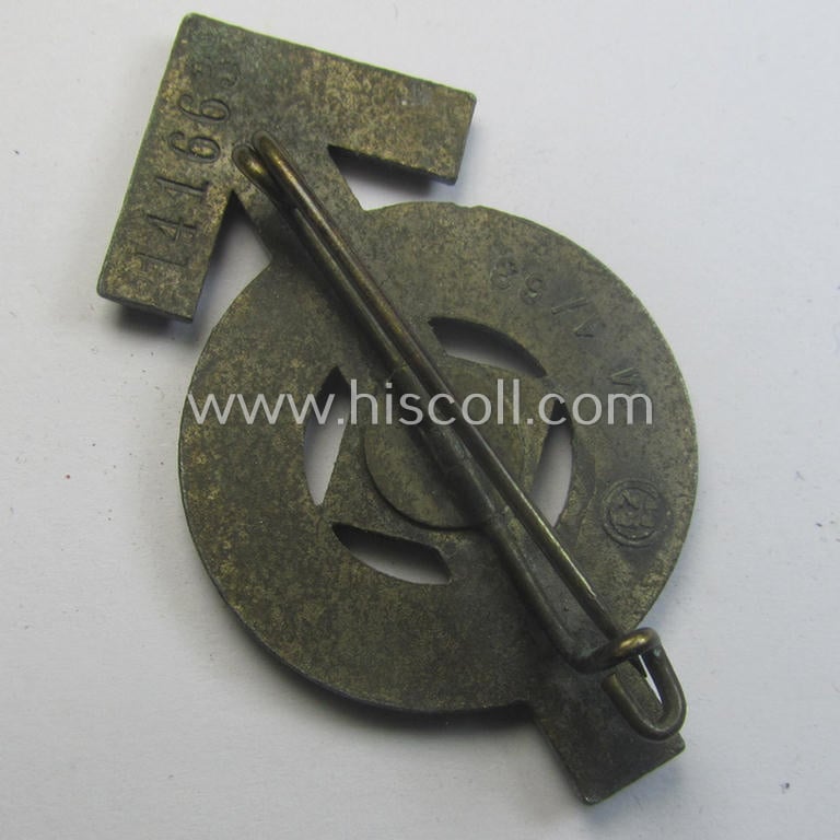 HJ- (ie. 'Hitlerjugend'-) sports-badge (or: 'HJ-Leistungsrune') of the bronze-class being a clearly maker- (ie. 'RzM - M1/63'-) marked- and/or: 'Feinzink'-based specimen that shows an engraved (unique!) bearers'-numeral ('141663')