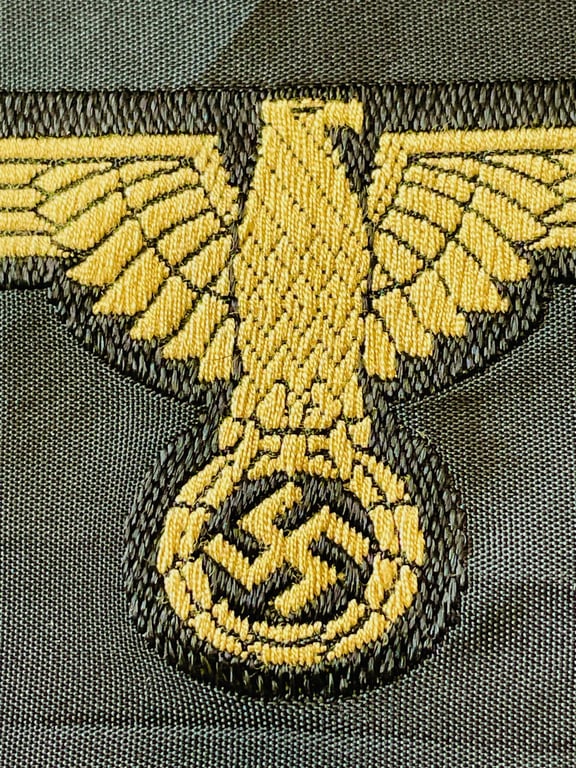 WWII GERMAN WAFFEN SS ARM EAGLE WITH SS PAPER ISSUED RZM TAG REMAINING.