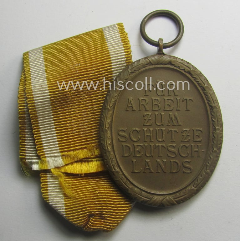 Medal-set: 'Deutsches Schutzwall Ehrenzeichen' (aka: 'Westwall'-medal) being a non-maker-marked- and/or: 'Buntmetall'-based specimen