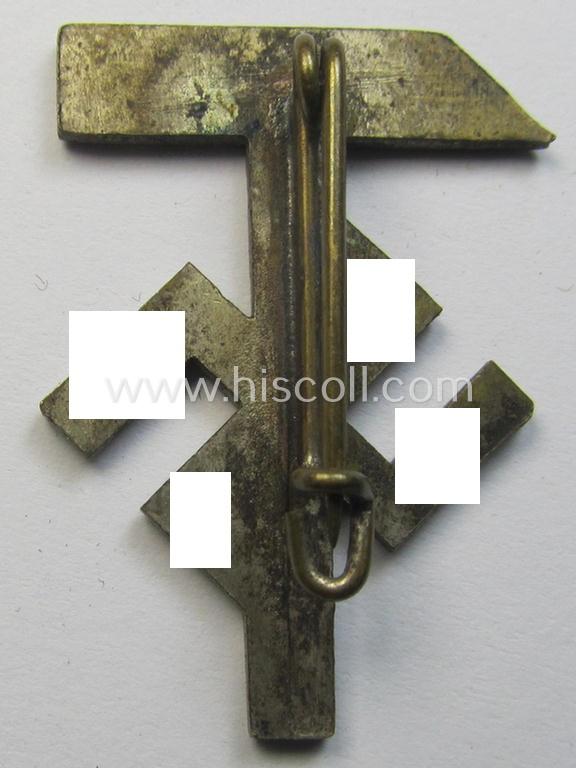 Attractive - and scarcely encountered! - commemorative lapel-pin (ie. 'Veranstaltungsabzeichen') being a non-marked example as executed in silverish-golden-toned 'Buntmetall' depicting a hammer-/swastika-device coupled with the text: '1. Mai 193...