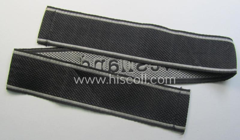 Waffen-SS, 1943/44 pattern cuff-title (ie. 'Ärmelstreifen') depicting the machine-woven Latin script text in silver-grey linnen as was intended for a member of the: 'SS-Regiment "Westland" (ie. part of the: '5. SS-Pz-Gren.-Div. "Wiking")