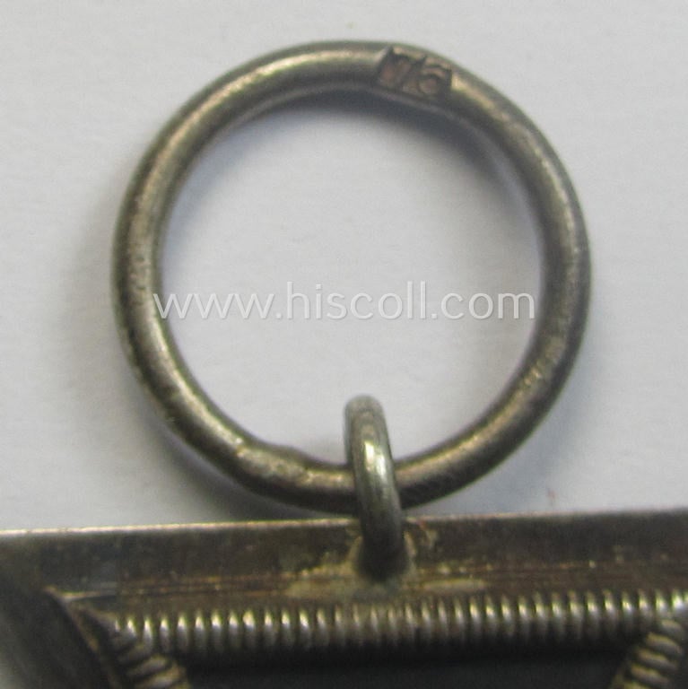 Iron Cross 2nd class (or: 'EK II. Klasse') being a maker- (ie. '76'-) marked example that comes together with its non-confectioned ribbon (ie. 'Bandabschnitt') as was produced by the maker (ie. 'Hersteller'): 'Ernst L. Müller'