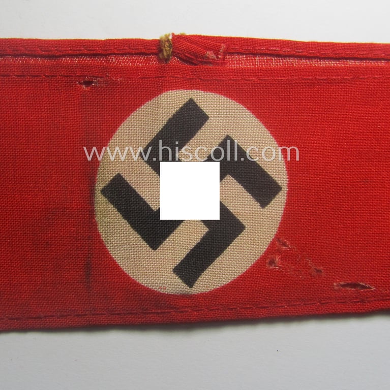 Truly worn, thin-shaped, 'N.S.D.A.P.'-related armband (ie. 'Armbinde') being of the 'entirely printed'-type showing a swastika-sign