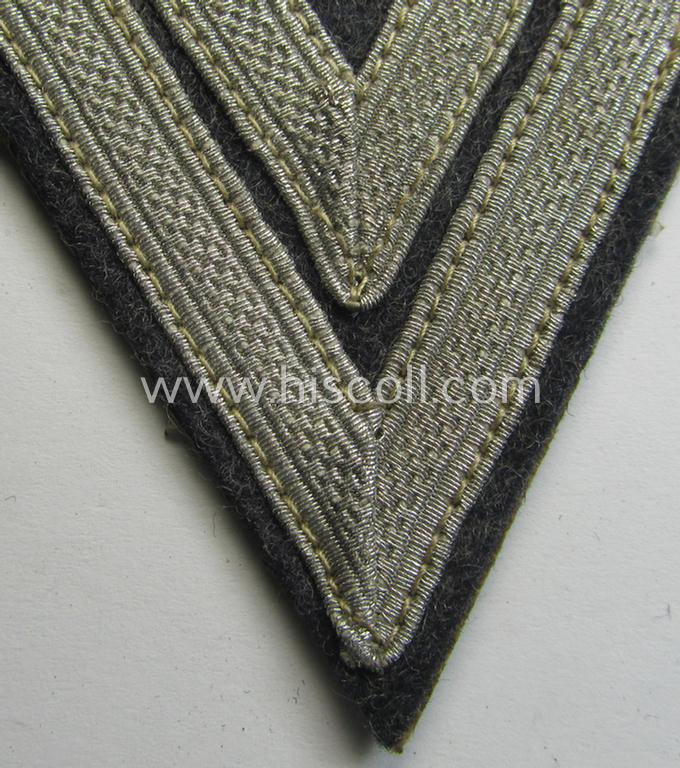 Neat, WH (Luftwaffe) 'Armwinkel' (or: arm-chevron) as executed on typical bluish-grey-coloured wool as was specifically intended for usage by a soldier holding the rank of: 'Obergefreiter'