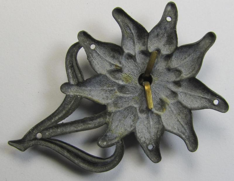 WH (Heeres) silver-greyish-coloured and zinc-based (albeit non-maker-marked) so-called: M43-cap-badge (ie. 'Mützenabzeichen') depicting an: 'Edelweiss'-flower as was used by the various 'Gebirgsjäger'- (ie. mountain-troops-) related divisional-...