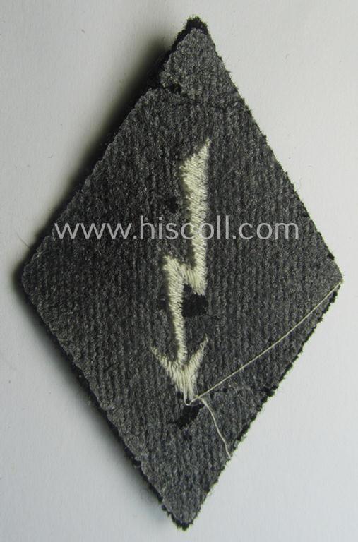 Waffen-SS-pattern, machine-embroidered and black-coloured sleeve-insignia (ie. 'Ärmelraute') depicting a: 'Signalblitz' ('SS-Nachrichten-Trpn.')