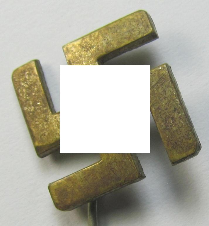 Unusually seen, golden-coloured (and - I deem - typical 'Buntmetall'-based) so-called: patriotic swastika lapel-pin (ie. 'N.S.D.A.P.-supportive piece) being an example that comes mounted onto its long-sized pin