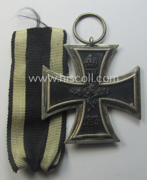 WWI-period: 'Eisernes Kreuz II. Klasse' (or: iron cross second class) being a (typical) non-maker-marked example that comes together with its (minimally) confectioned piece of ribbon (ie. 'Bandabschnitt')