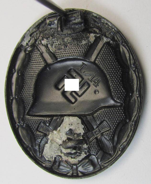 Truly rarely found - and neatly maker- (ie. 'L/14'-) marked! - example of a black-class wound-badge (or: 'Verwundeten-Abzeichen in Schwarz') as was produced by the (unusually seen!) maker (ie. 'Hersteller'): 'Friedrich Orth' based in Wien