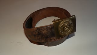 S.A brown leather belt and buckle