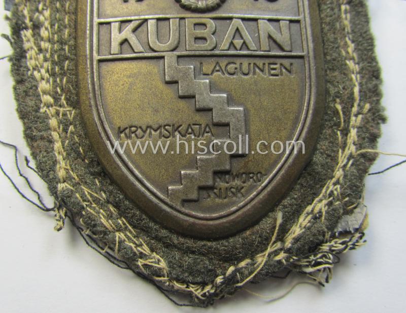 Attractive - truly worn and actually scarcely encountered! - WH (Heeres ie. Waffen-SS) 'Kuban'-campaign-shield that comes mounted onto its original field-grey-coloured- and/or woolen-based 'backing' as issued and/or used