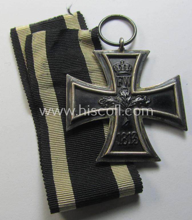 Attractive, WWI-period: 'Eisernes Kreuz II. Klasse' (or: iron cross second class) being a clearly maker- (ie. 'KO'-) marked example that comes together with its (minimally) confectioned piece of ribbon (ie. 'Bandabschnitt')