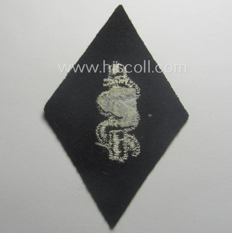 Waffen-SS-pattern, machine-embroidered and/or black- and white-coloured sleeve-insignia (ie. 'Ärmelraute') depicting a so-called: 'Aesculapus'-sign as was used and intended to signify membership within the 'SS-Sanitätsdienst'