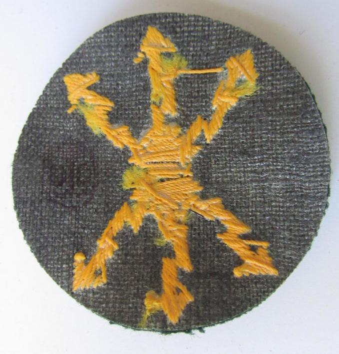 Attractive, WH (Heeres) so-called: trade- and/or special career arm-insignia, as was intended for a: 'Funkmeister', being a neatly hand-embroidered variant on darker-green-coloured wool