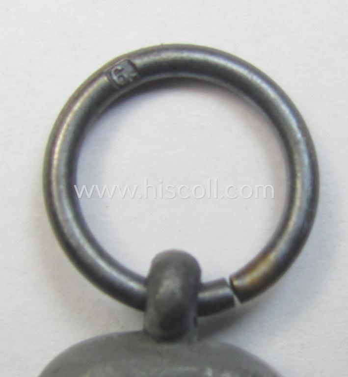 Attractive medal-set: 'Winterschlacht im Osten 1941-42' being a maker- (ie. '6.'-) marked- (and/or 'Feinzink'-based) specimen by the maker: 'Fritz Zimmermann' and that comes together with its (minimally confectioned) ribbon (ie. 'Bandabschni...