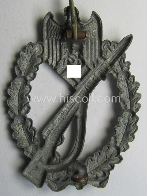 'Infanterie Sturmabzeichen in Silber', being an unmarked (and/or very converse- ie. vaulted-) 'hollow-back' example by the maker: 'Friedrich Linden' (ie. 'F.L.L.') as was executed in silver-coloured, zinc-based metal (ie. 'Feinzink')