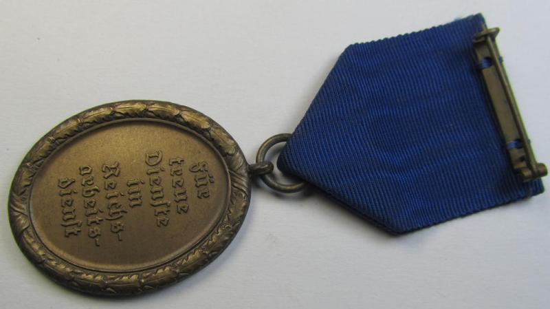 Attractive example of a: RAD (ie. 'Reichsarbeitsdienst') so-called: 'Dienstauszeichnung 4. Stufe für Männer' as was intended for 4 years loyal-service and that comes mounted onto its period piece of ribbon (ie. 'Bandabschnitt')