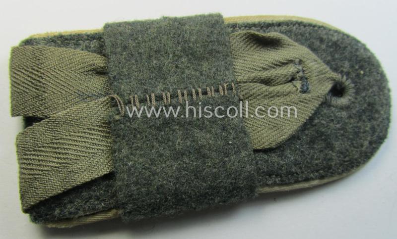 Attractive - albeit regrettably single! - later-war-period- (ie. 'M44 o. M45'-pattern-) WH (Heeres) EM-type shoulderstrap that comes with its attached 'Übershube' as was intended for a: 'Soldat des Inf.-Maschinengewehr-Abts. 14'