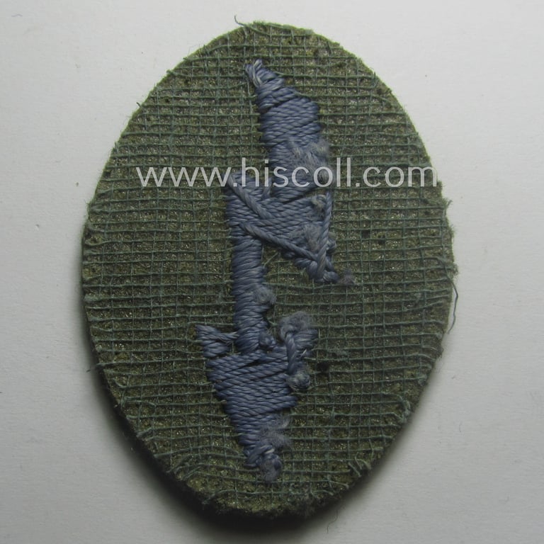 WH (Heeres) trade- and/or special-career-insignia ie. hand-embroidered 'signal-blitz' being a non-maker-marked example as executed in light-blue-coloured linnen as was specifically intended for a soldier within the: 'Nachschub-Trpn.'