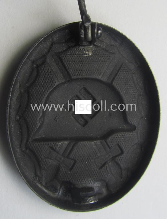 Black-class wound-badge (or: 'Verwundeten-Abzeichen in Schwarz') being a maker- (ie. '4'-) marked specimen as was produced by the maker (ie. 'Hersteller') named: 'Steinhauer & Lück'