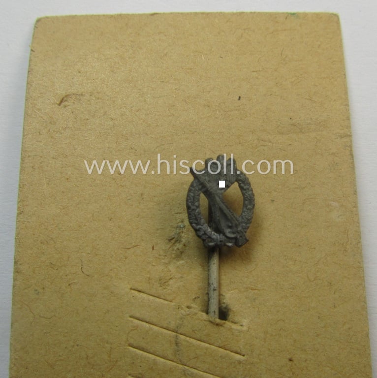 Neat - and only 9 mm. sized! - miniature-lapel-pin depicting an: 'Infanterie Sturmabzeichen in Silber' (or: silver-class assault-badge ie. IAB) being a non-maker-marked example that comes mounted onto its period 'LDO'-card