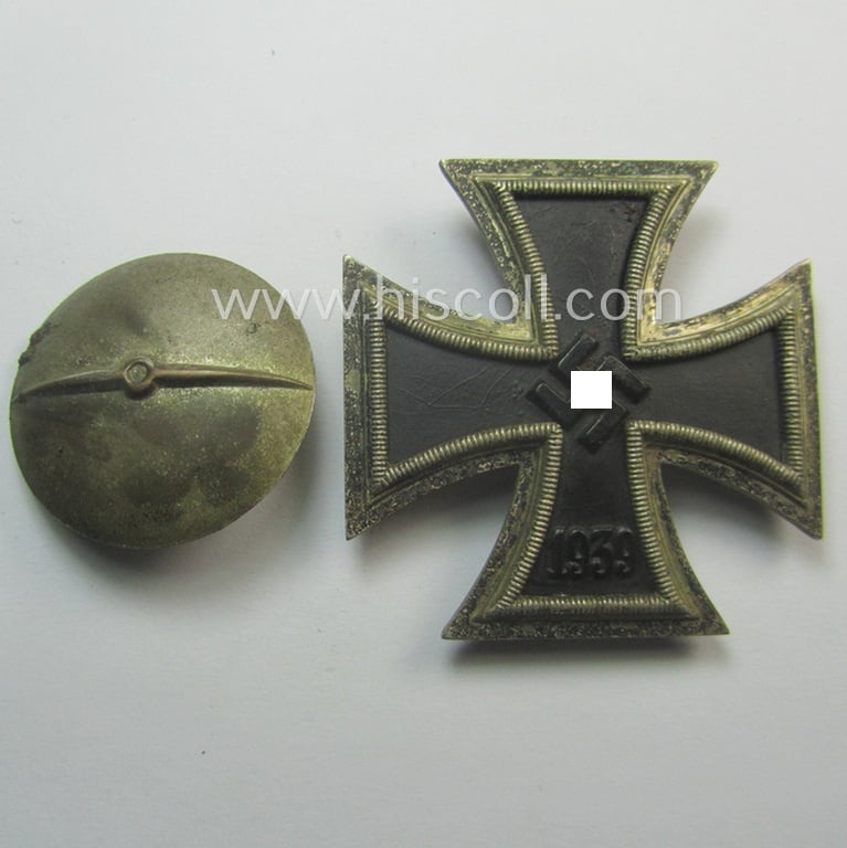 Attractive - and just moderately used! - Iron Cross 1st class (or: 'Eisernes Kreuz 1. Kl.') as executed in the scarcely seen so-called: 'screw-back'- (ie. 'An der Schraube'-) pattern being a typical non-maker-marked example by: 'Steinhauer & Lück'