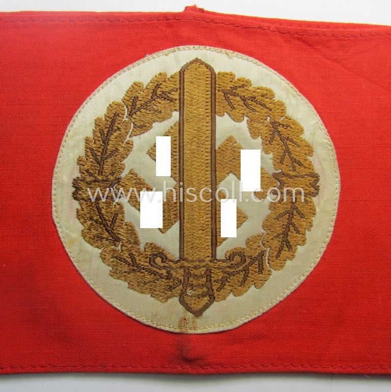 Moderately used and/or worn, linnen-based armband (ie. 'Armbinde') as was intended for usage by the staff of the: 'SA-Wehrmannschaften' (being a worn example that still retains its period-attached 'RzM'-etiket)