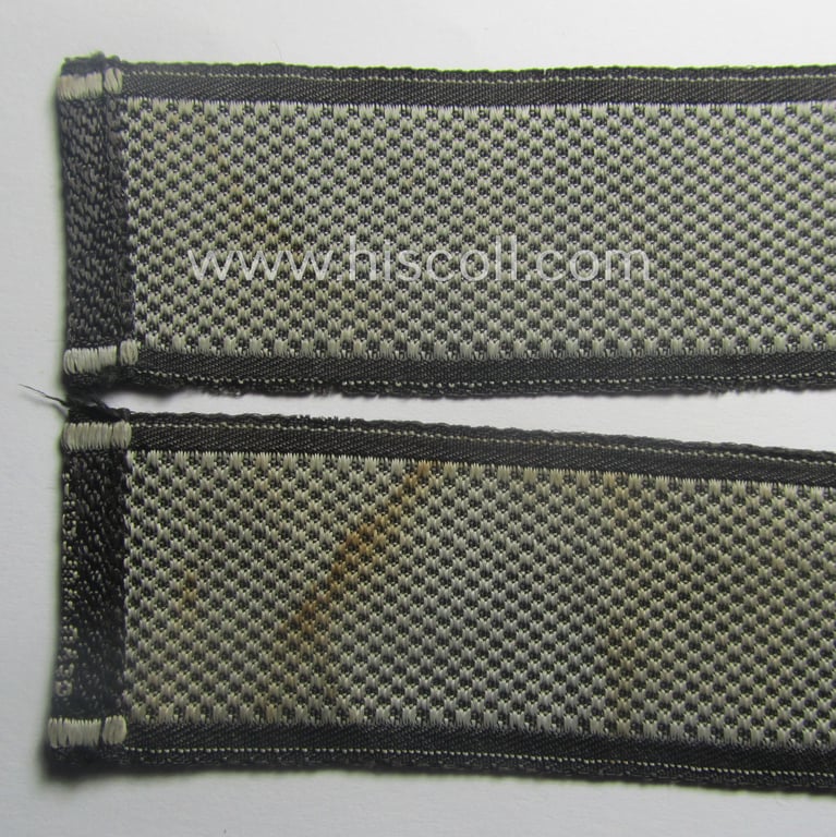 Waffen-SS, 1943/44 pattern cuff-title (ie. 'Ärmelstreifen') depicting the machine-woven Latin script text in silver-grey linnen as was intended for a member of the: 'SS-Regiment': "Westland" (ie. part of the: '5. SS-Pz-Gren.-Div. "Wiking")